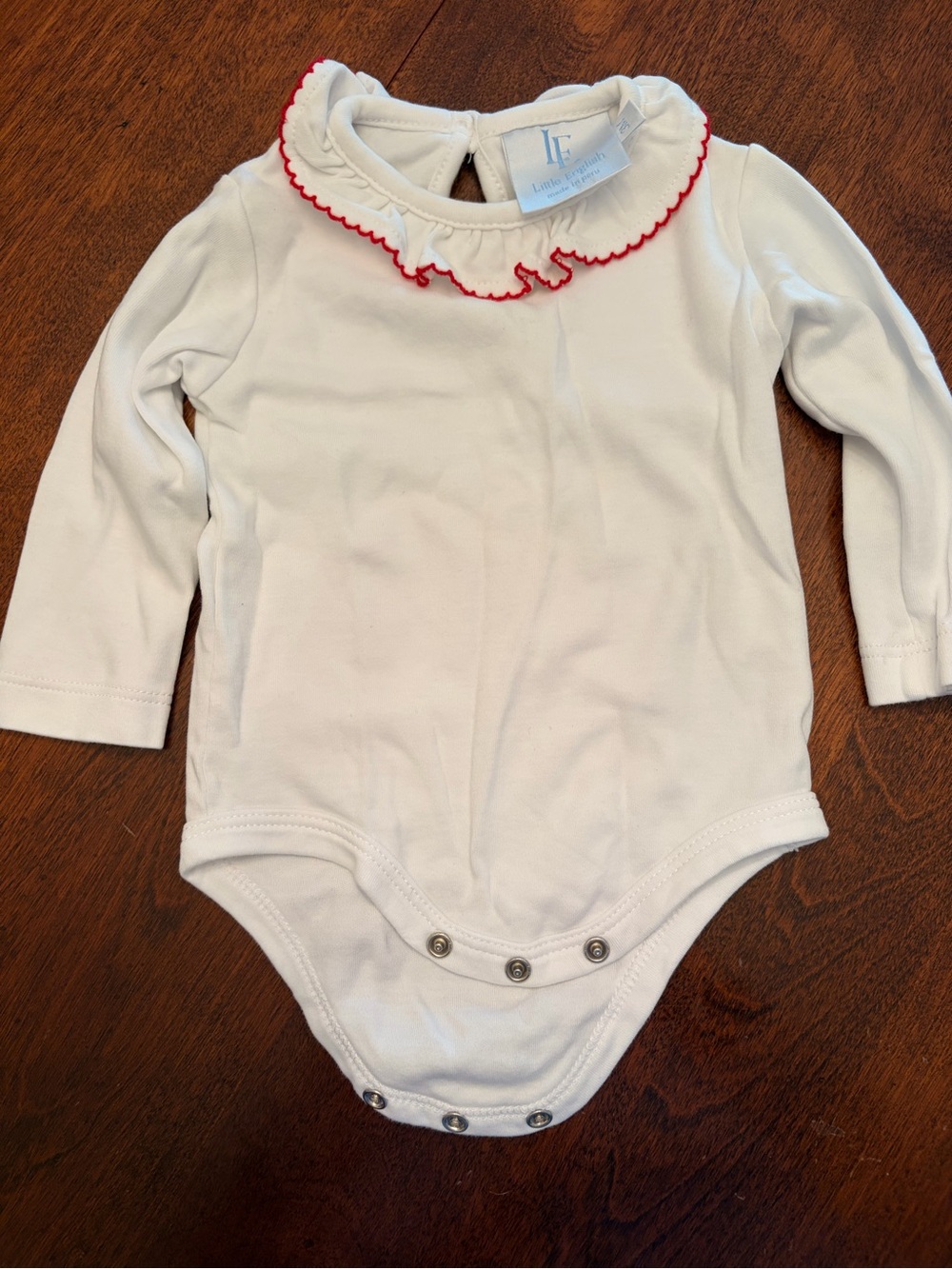 Little English White Baby Onesie with Red Scalloped Trim